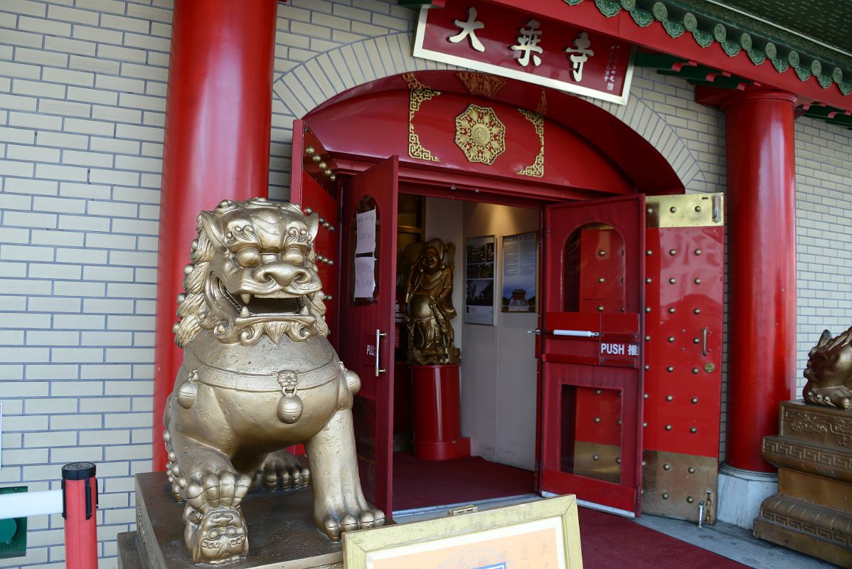 13-2 A Golden Lion Guards The Entrance To Mahayana Buddhist Temple At 133 Canal St In Chinatown New York City